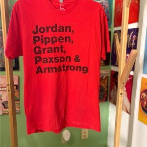 Red Graphic T-Shirt with Black Text